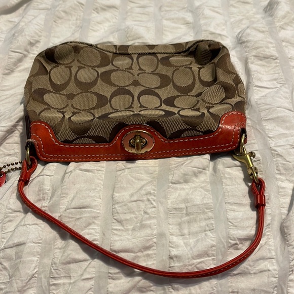 Coach Handbags - COACH MONOGRAM CLOTH WRISTLET TOGGLE PURSE SMALL BROWN AND ORANGE